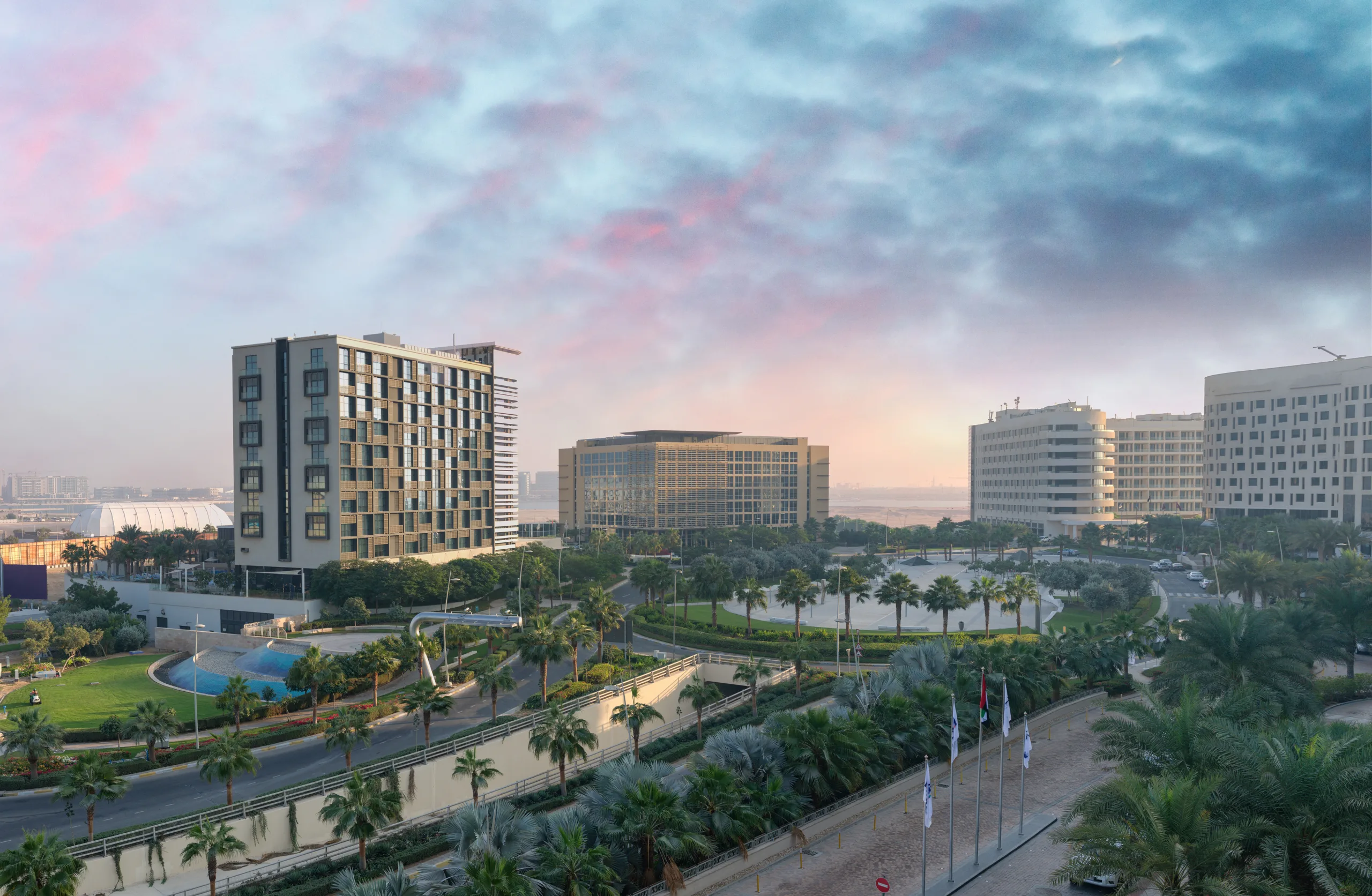 Aerial view of Abu Dhabi Yas Island skyline at sunset, UAE.