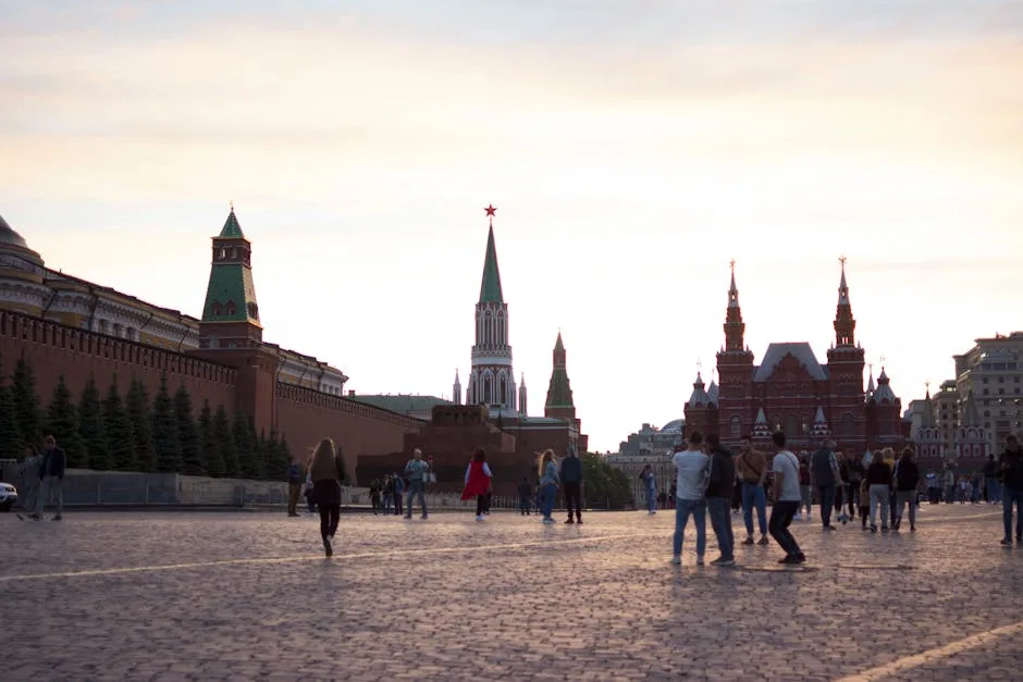 Visitors enjoy the iconic Red Square in Moscow, a UNESCO site, at sunset.