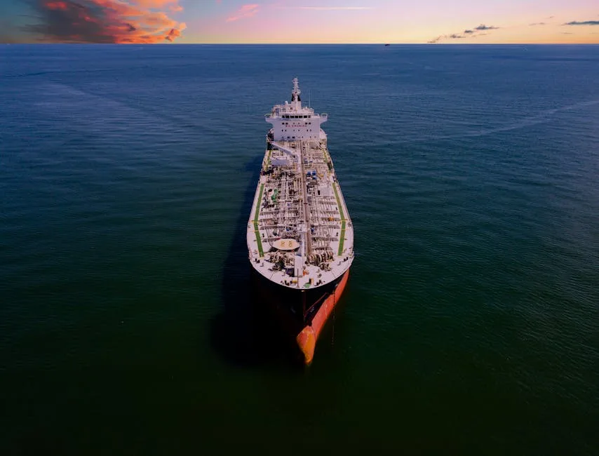 Aerial shot of an oil tanker on the ocean at sunset in Galveston, Texas.