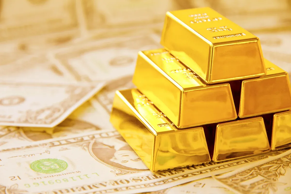 Gold edges lower as dollar rises and Iran talks loom
