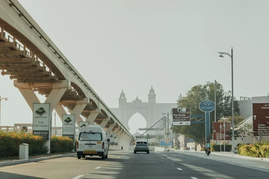 Explore Dubai's modern infrastructure near the iconic Atlantis Hotel and monorail track.