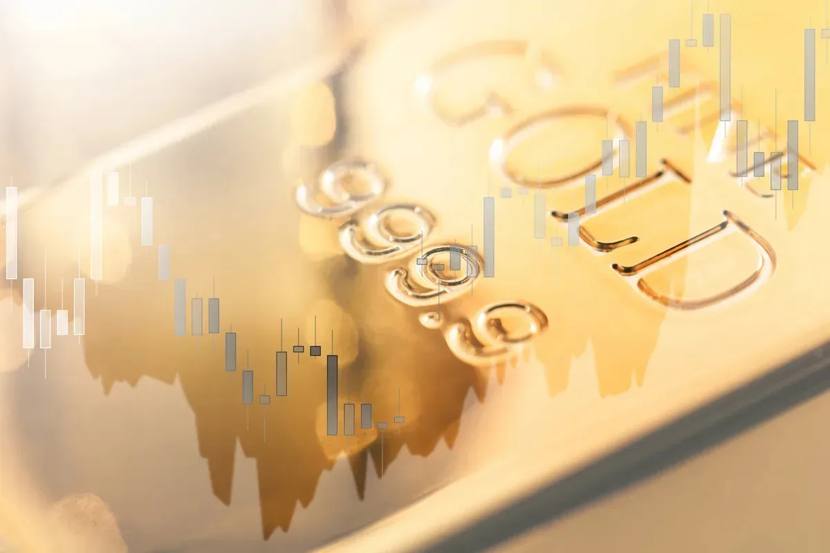 Gold pulls back from two-week high as oil surges